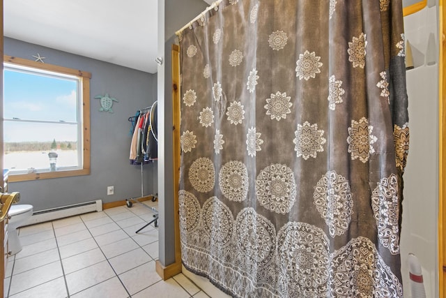 bathroom featuring tile patterned floors and baseboard heating