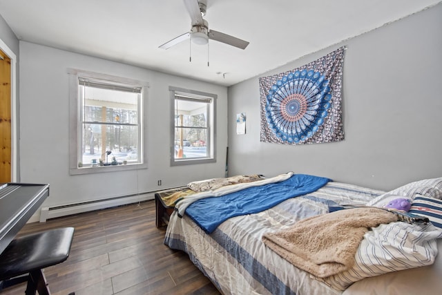 bedroom with dark hardwood / wood-style flooring, ceiling fan, and baseboard heating