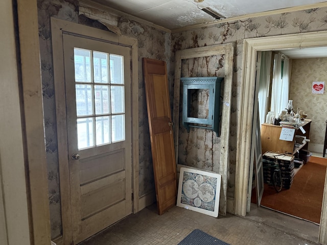 entryway with crown molding and wallpapered walls