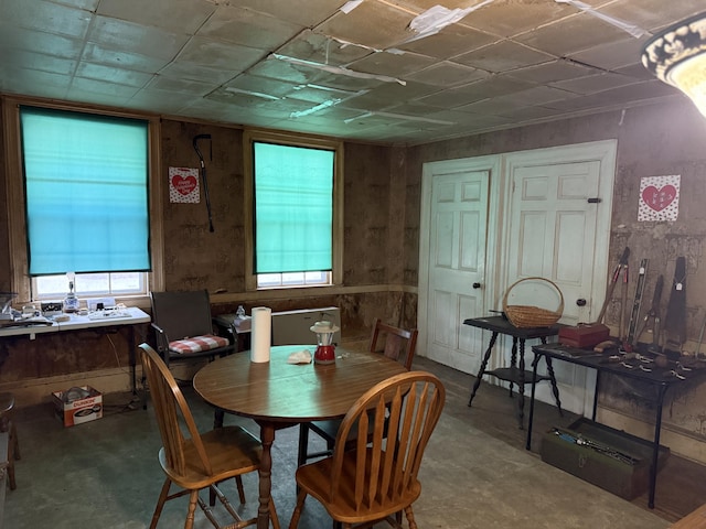 dining space featuring concrete floors