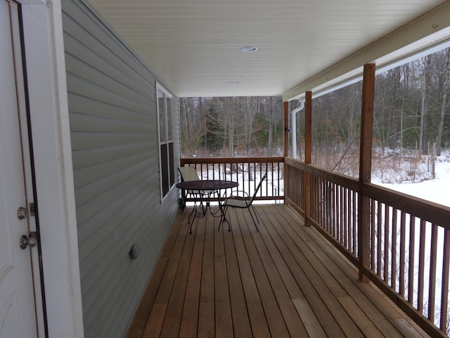 view of snow covered deck