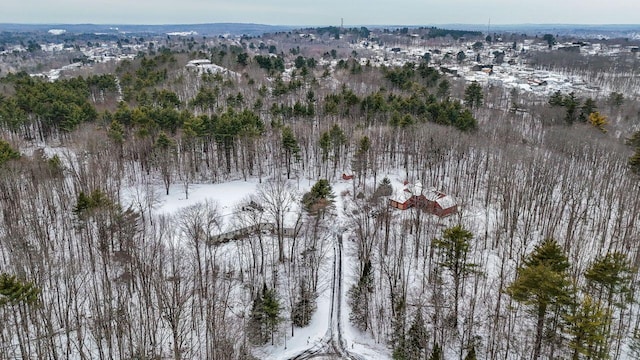 drone / aerial view with a wooded view