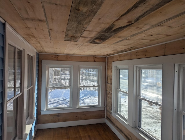 unfurnished sunroom featuring wooden ceiling