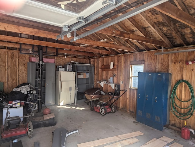 garage featuring wood walls