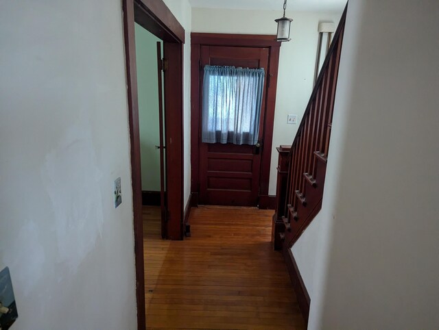 hall featuring stairway and dark wood finished floors