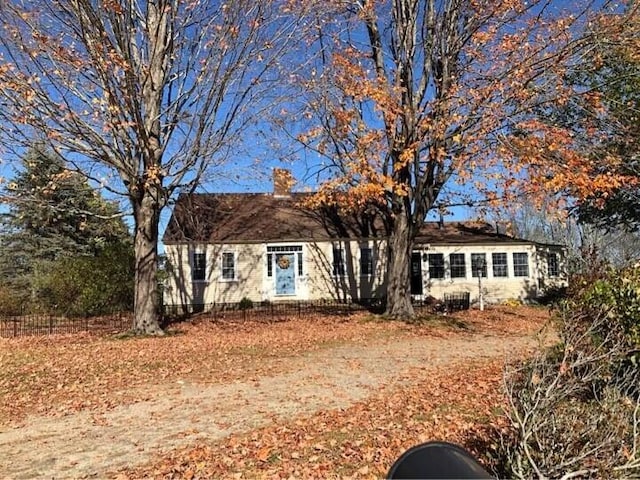 view of front of home featuring a chimney