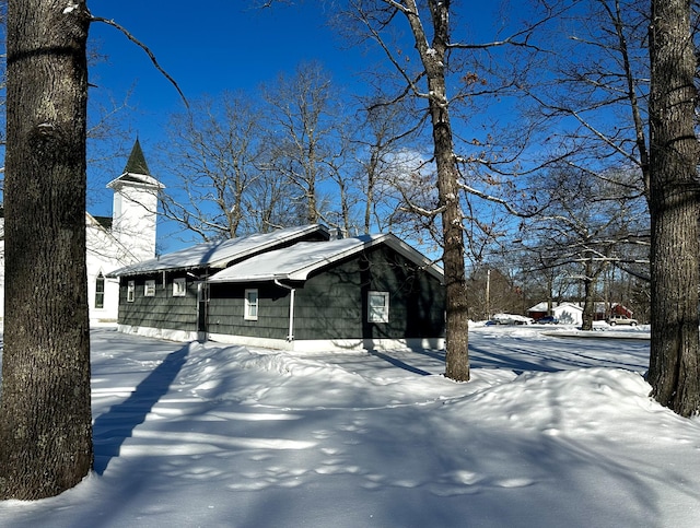 view of snow covered property