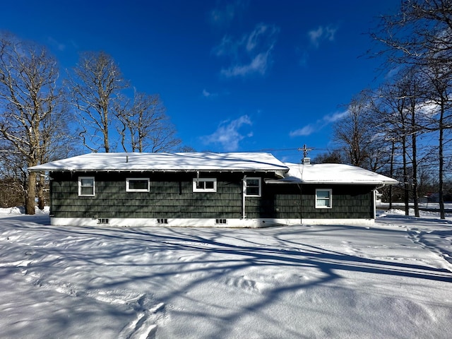 view of snow covered house