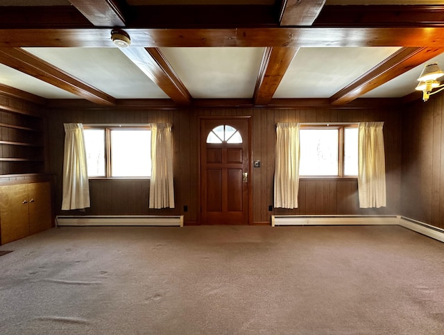 entryway featuring carpet flooring, a baseboard heating unit, beam ceiling, and wood walls