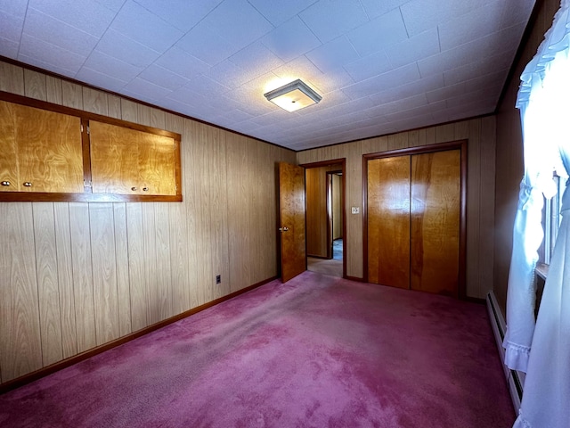 unfurnished bedroom with light colored carpet and a closet