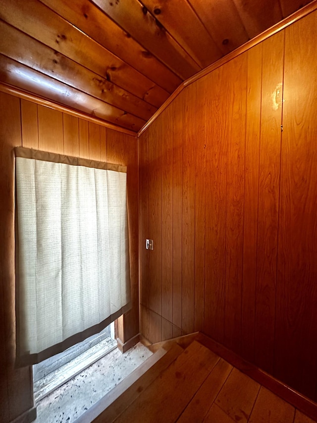 bathroom with wood ceiling, lofted ceiling, wooden walls, and hardwood / wood-style flooring