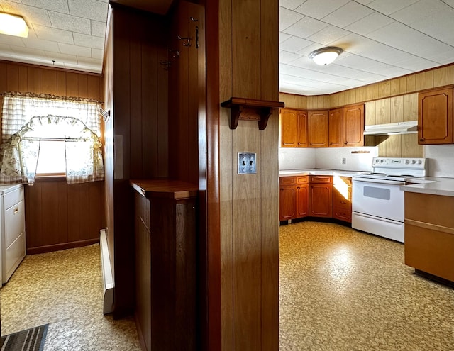 kitchen with white electric stove and wooden walls