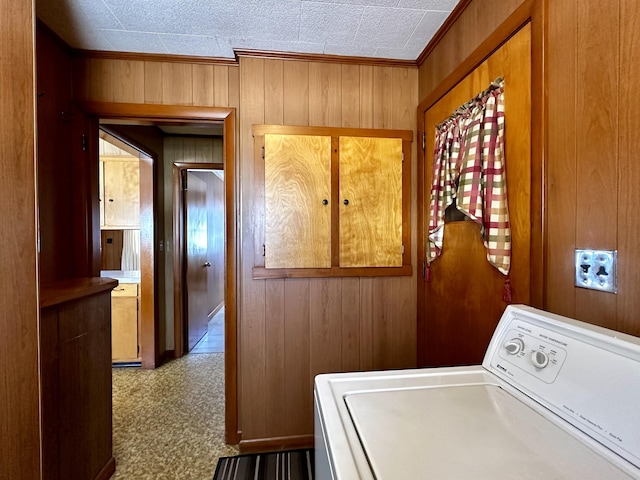 laundry room with washer / dryer, carpet, and wood walls