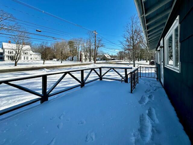 view of yard layered in snow