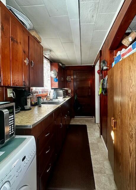 kitchen with sink and washer / dryer