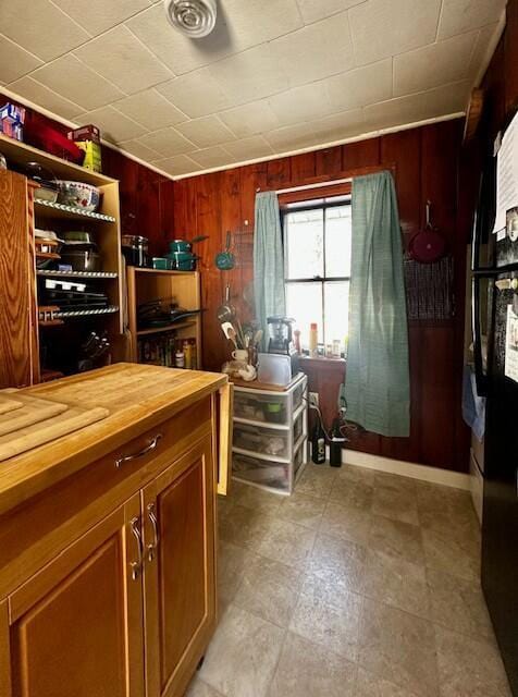 interior space with wooden walls and wood counters