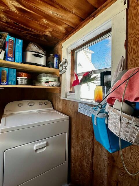 laundry area featuring washer / clothes dryer, wooden walls, and wood ceiling