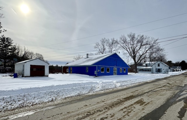 view of snow covered garage