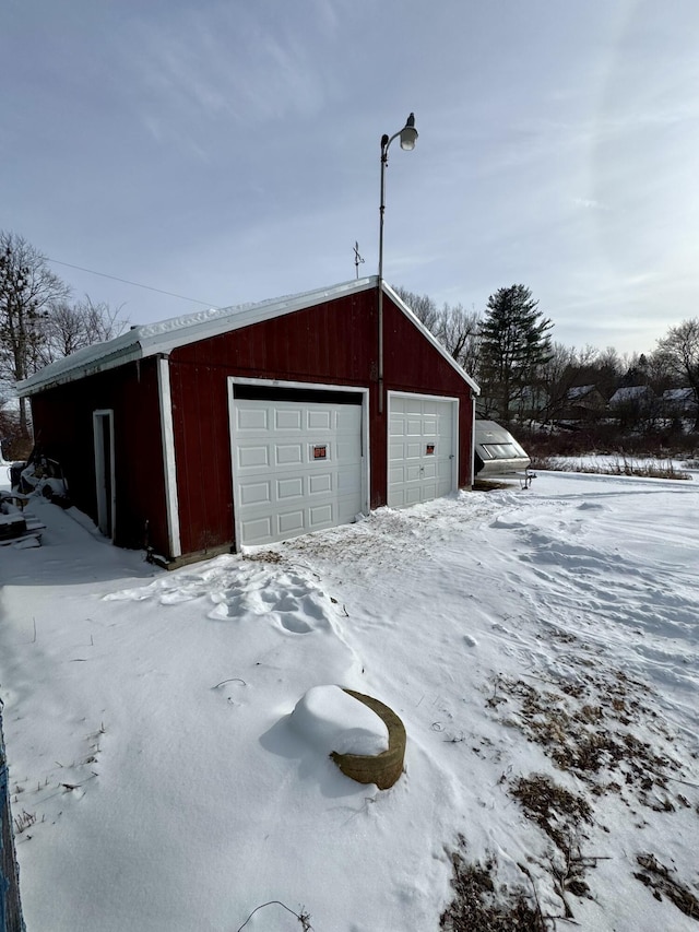 view of snow covered garage