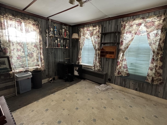 miscellaneous room with ceiling fan and radiator