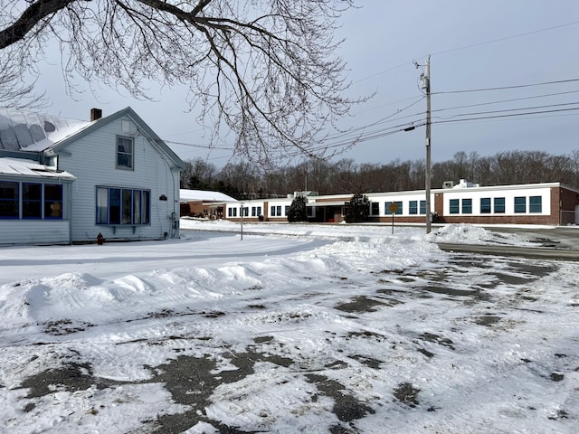 view of yard layered in snow