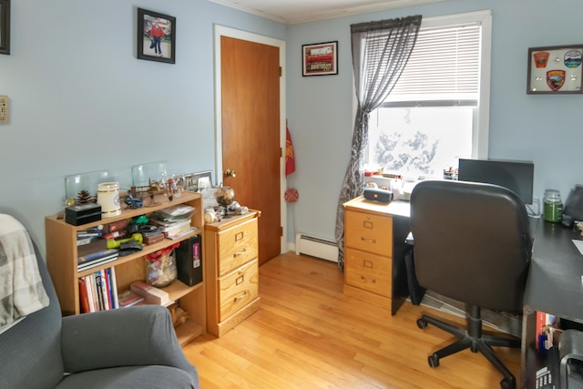 office with light wood-type flooring and a baseboard heating unit