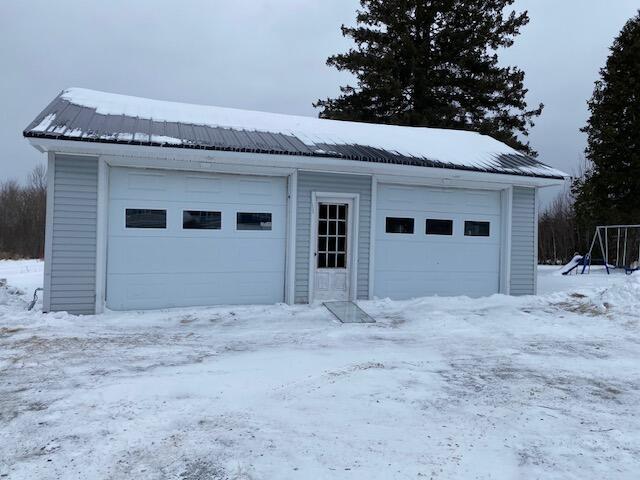 view of snow covered garage