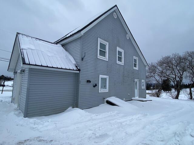 view of snow covered property