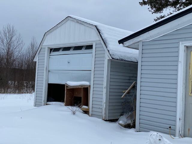 view of snow covered garage