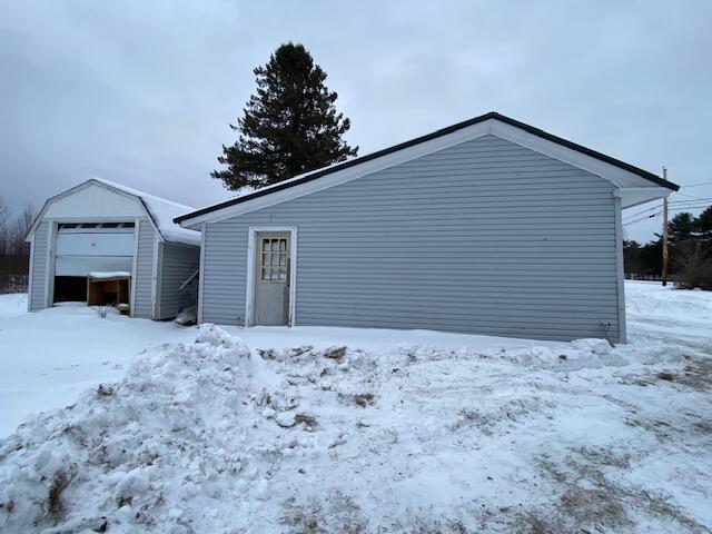 view of snow covered garage