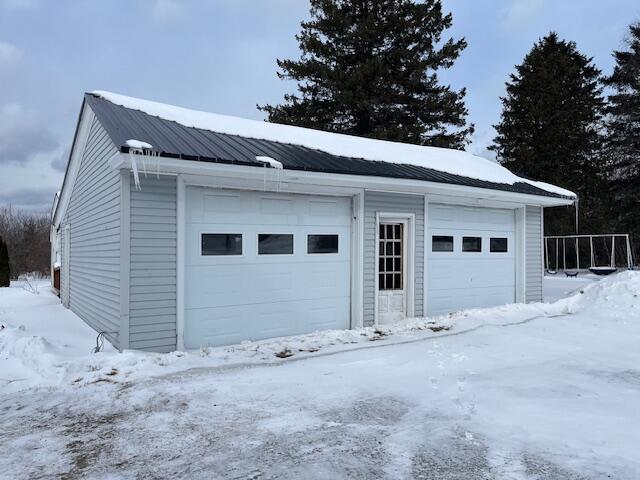 view of snow covered garage