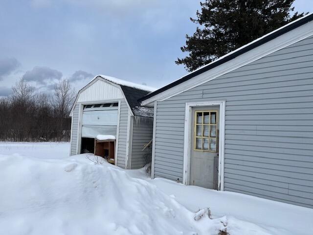 view of snow covered garage