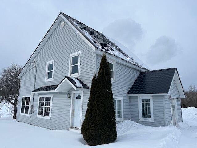 view of snow covered property