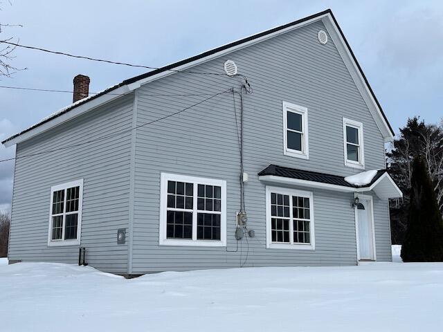 view of snow covered property