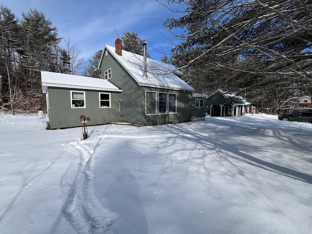 view of snow covered house