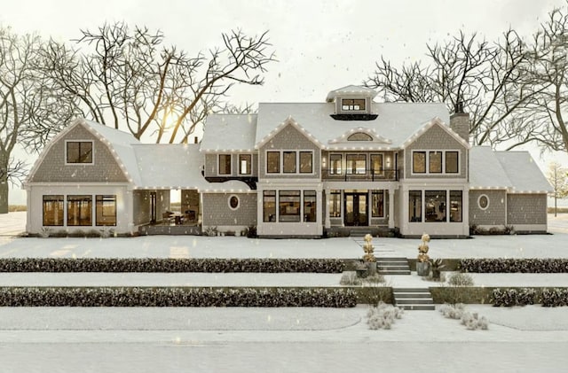 view of snow covered house