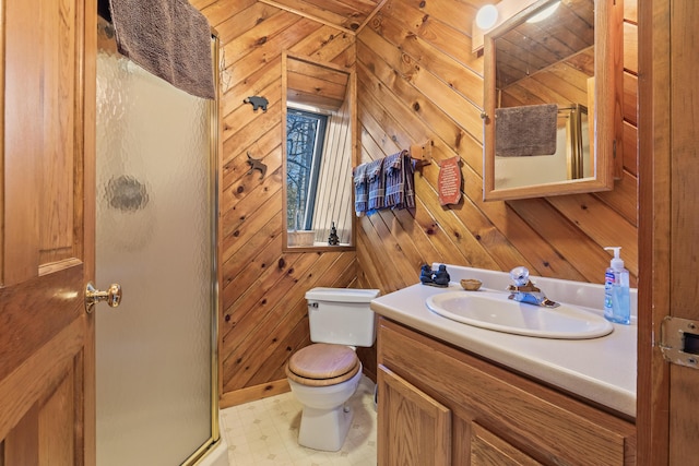 bathroom featuring vanity, walk in shower, toilet, and wood walls