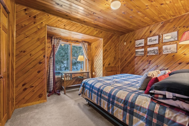 bedroom featuring wooden walls, carpet flooring, and wooden ceiling