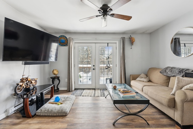 living room featuring french doors, ceiling fan, and hardwood / wood-style floors