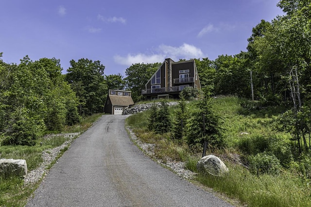 40 Skyline Dr, Holden, ME 04429 - a-frame style home with driveway and a garage