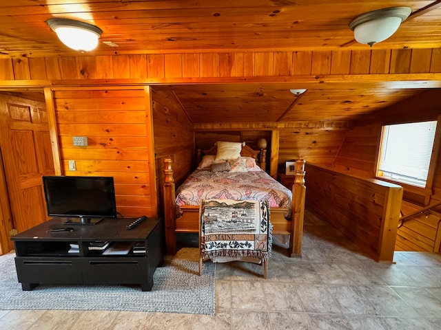 bedroom with vaulted ceiling, wooden ceiling, and wood walls