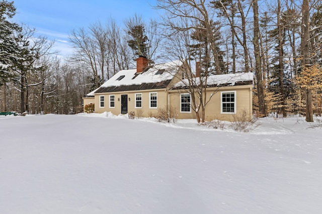 view of front of home with a chimney