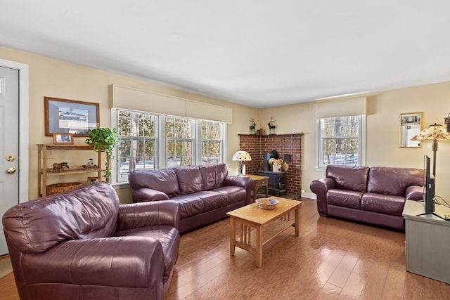 living area with hardwood / wood-style floors and a wealth of natural light