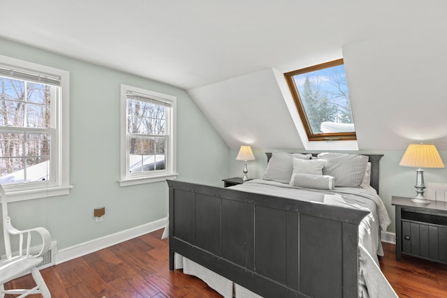 bedroom with visible vents, vaulted ceiling, baseboards, and dark wood finished floors