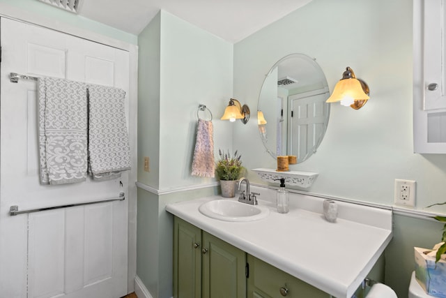 bathroom featuring vanity and visible vents