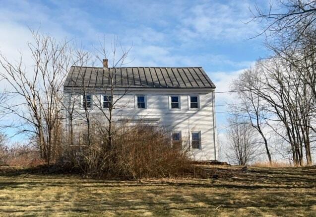 view of home's exterior featuring a lawn