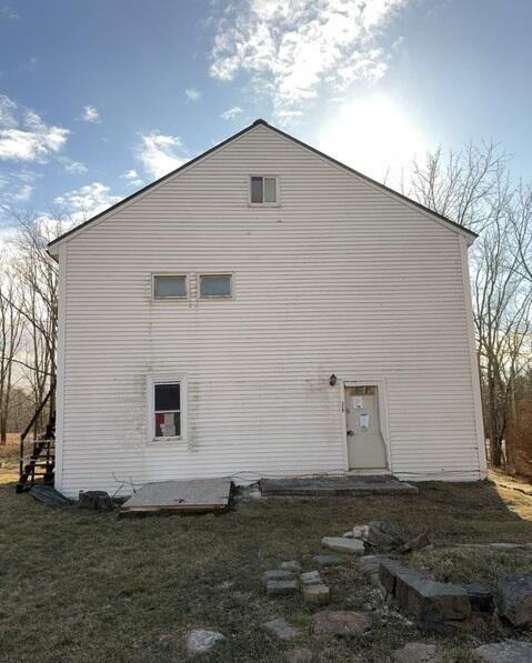 view of property exterior featuring a yard