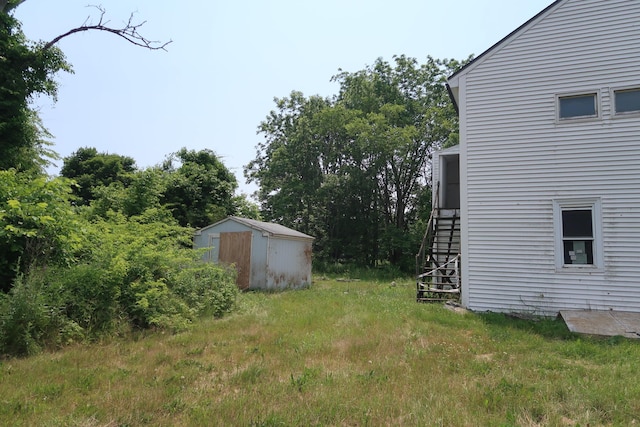 106 Eugley Hill Rd, Nobleboro, ME 04555 - view of yard featuring a storage shed and stairway
