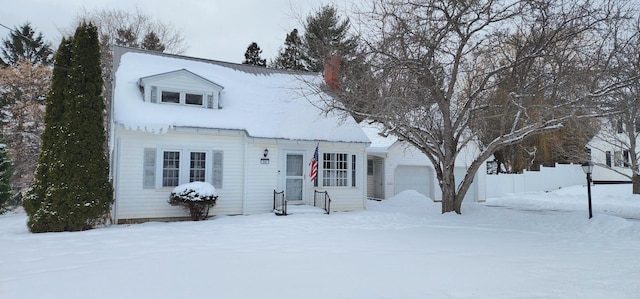 cape cod house with a garage