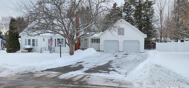 view of front of property featuring fence